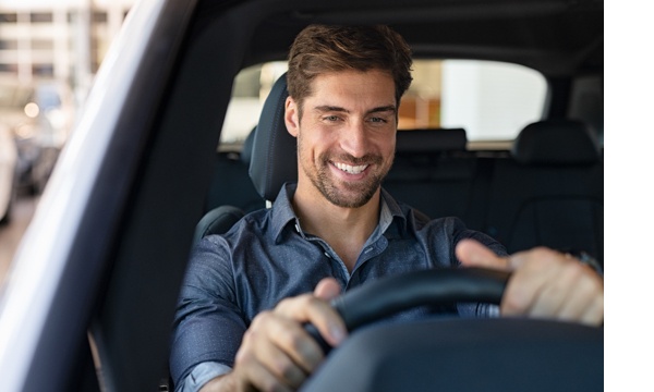 man driving car